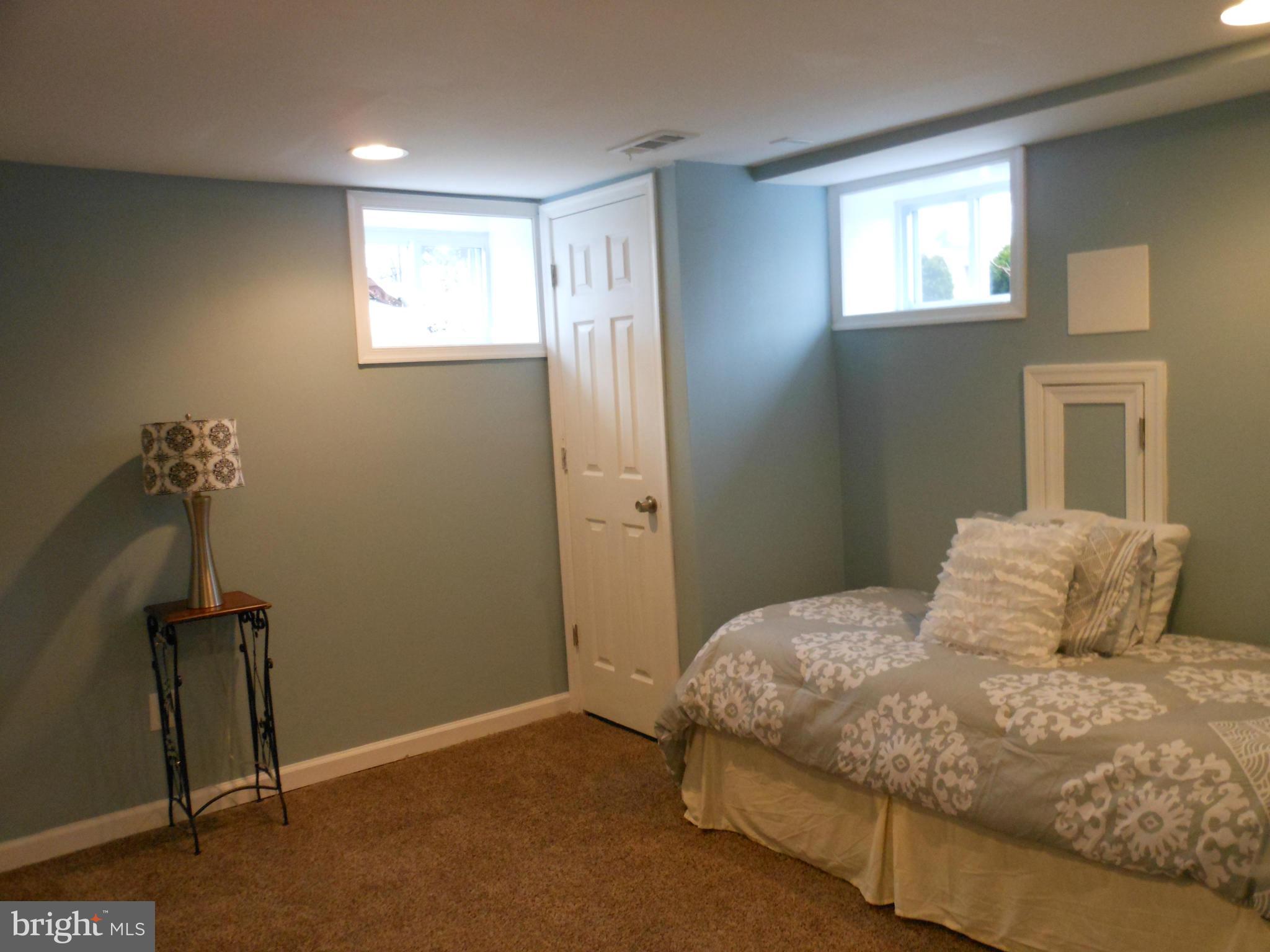7302 Dooman Road Baltimore, MD 21244 - Photo 23 of 29 a bedroom with a bed and a window