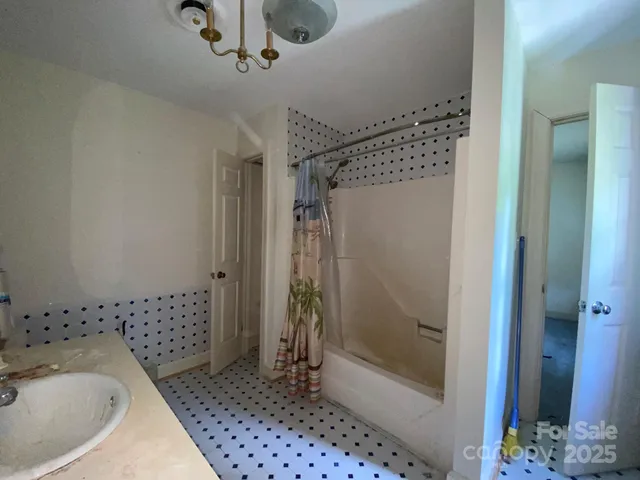 a backyard of a house with barbeque oven