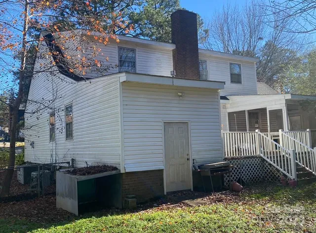 a view of a brick house with many windows