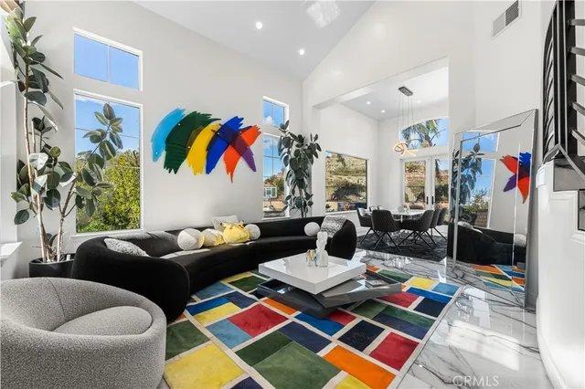 a bed room with furniture and a rug