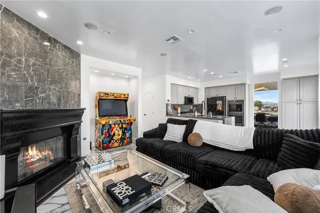 a kitchen with stainless steel appliances kitchen island granite countertop a refrigerator and stove top oven