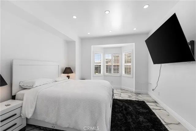 a bedroom with a bed and a walk in closet