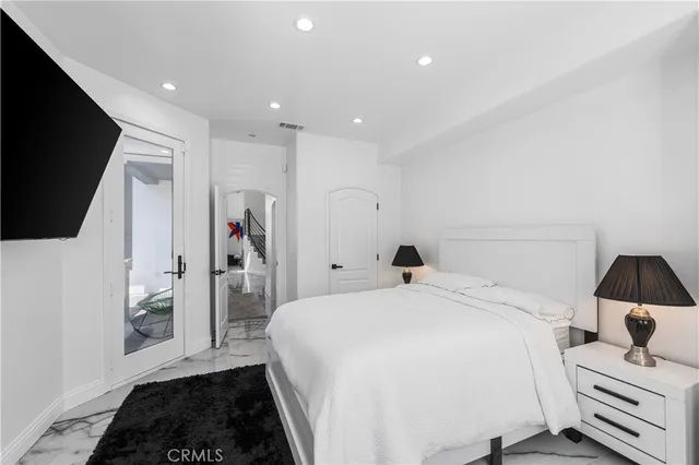 a bathroom with a sink mirror and toilet