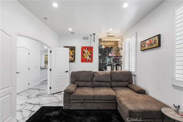 a view of a hallway with painting on the wall