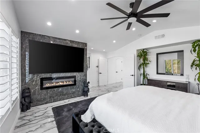 a bathroom with a sink mirror and a shower