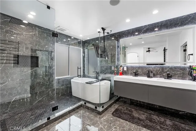 a room with sink and mirror