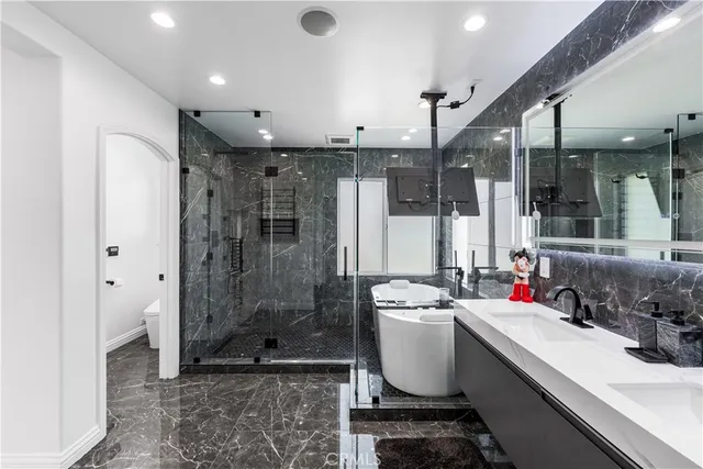 a bathroom with a sink and a shower
