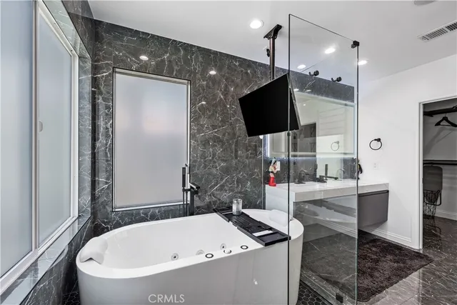 a view of a hallway with a couch and stairs