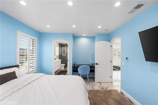 a bathroom with a double vanity sink toilet and shower