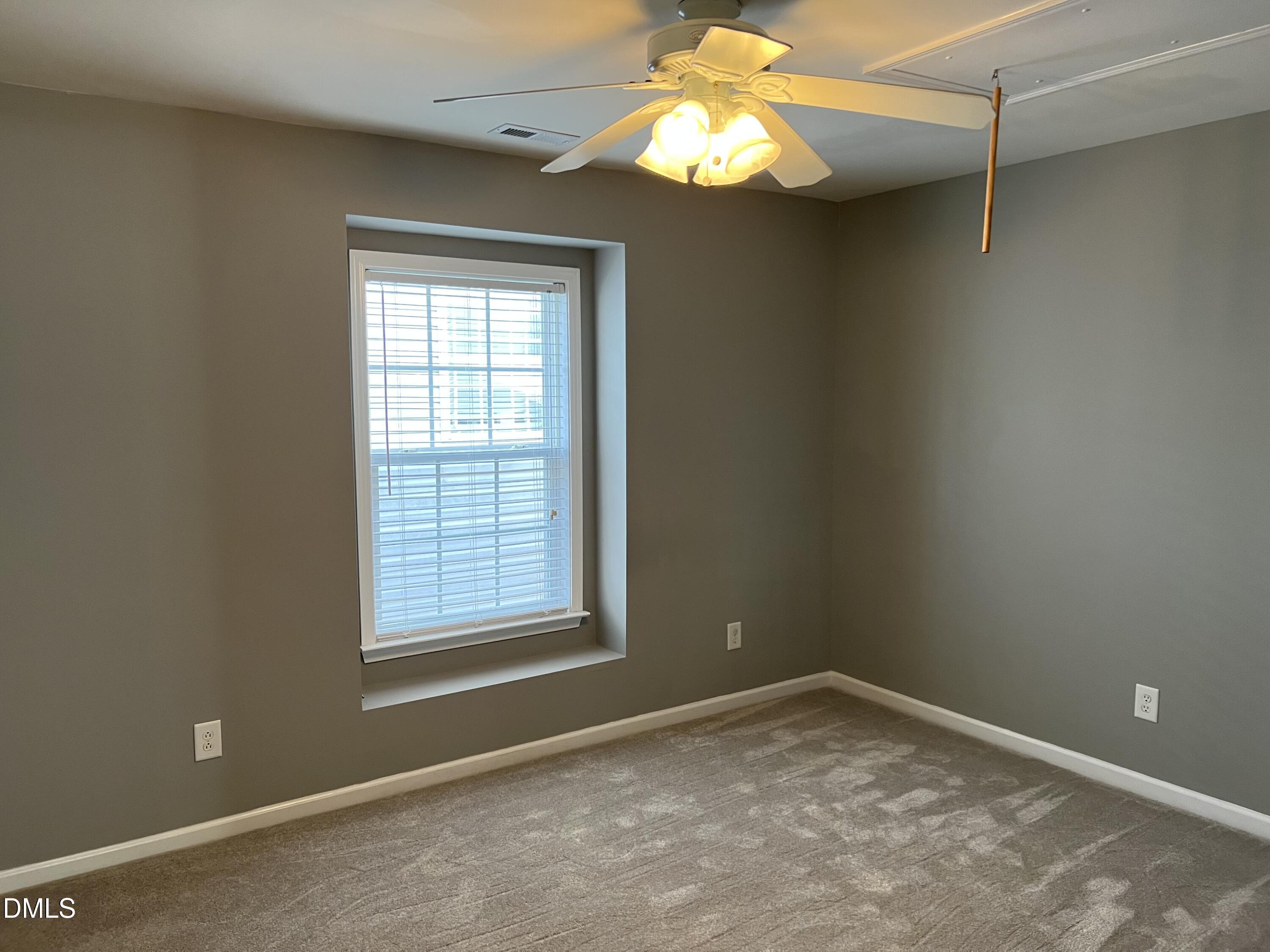 527 Emerald Downs Road Cary, NC 27519 - Photo 10 of 12 an empty room with a window