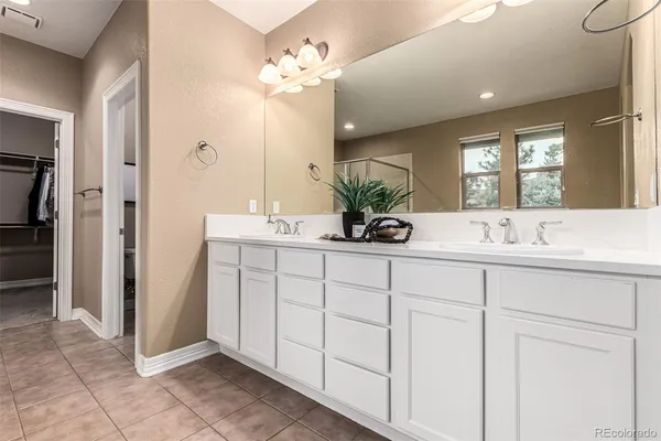 a spacious bathroom with a bathtub and a shower