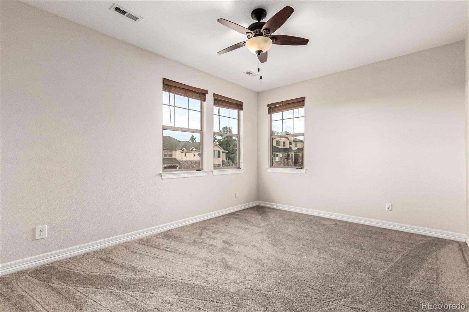 20166 East Shady Ridge Road Parker, CO 80134 - Photo 29 of 50 a view of an empty room with a window