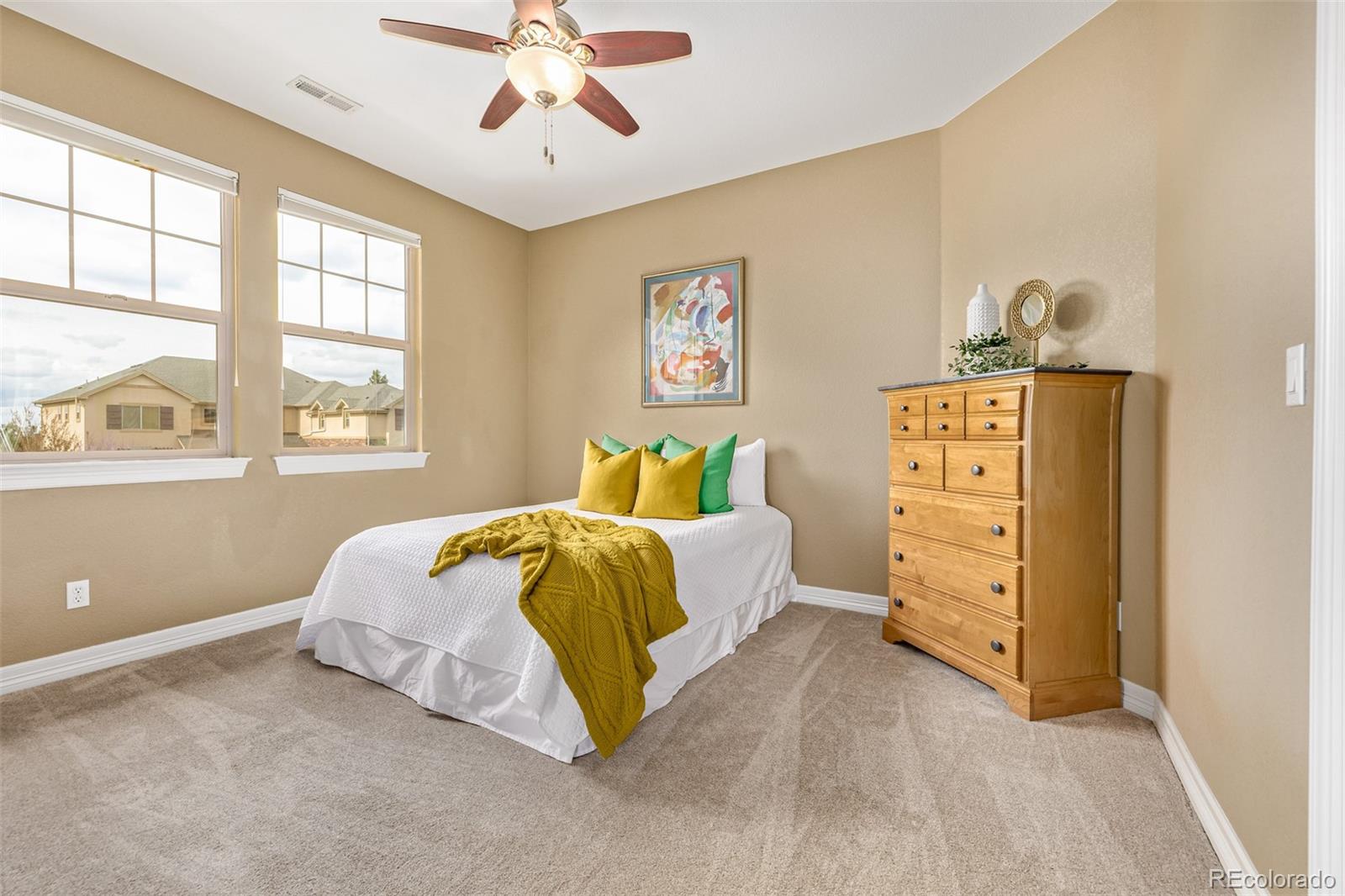 20166 East Shady Ridge Road Parker, CO 80134 - Photo 30 of 50 a bedroom with a bed and a dresser