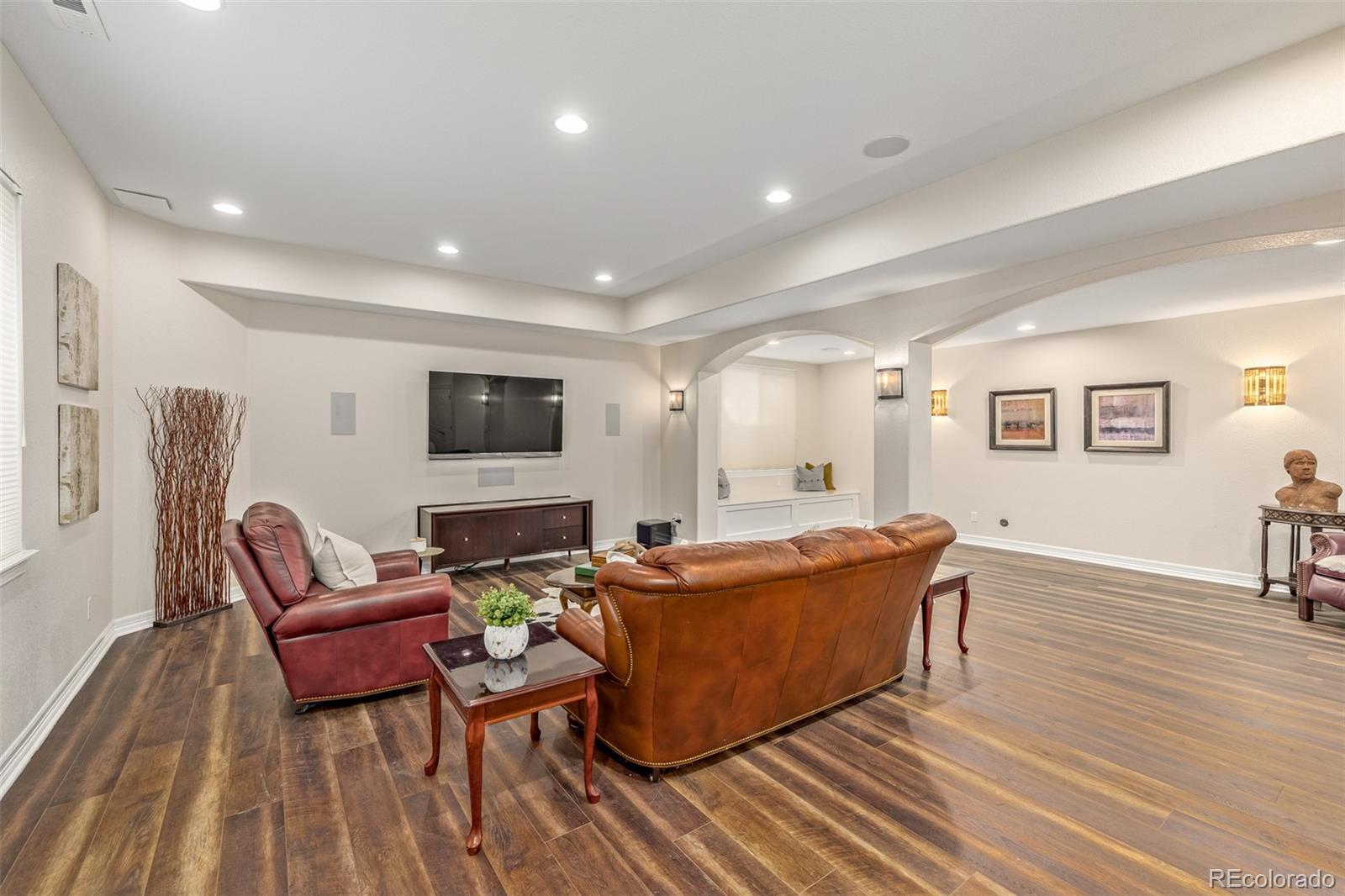 20166 East Shady Ridge Road Parker, CO 80134 - Photo 34 of 50 a living room with furniture and a flat screen tv
