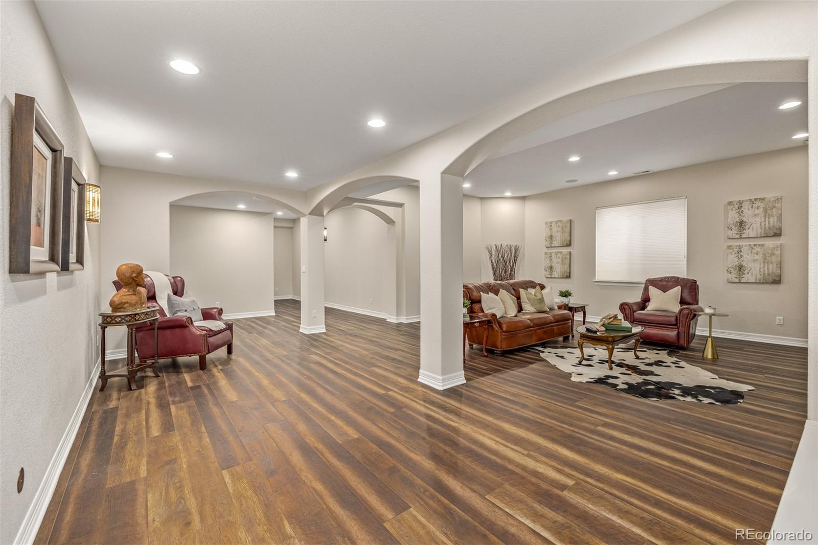 20166 East Shady Ridge Road Parker, CO 80134 - Photo 35 of 50 a living room with furniture window and a table