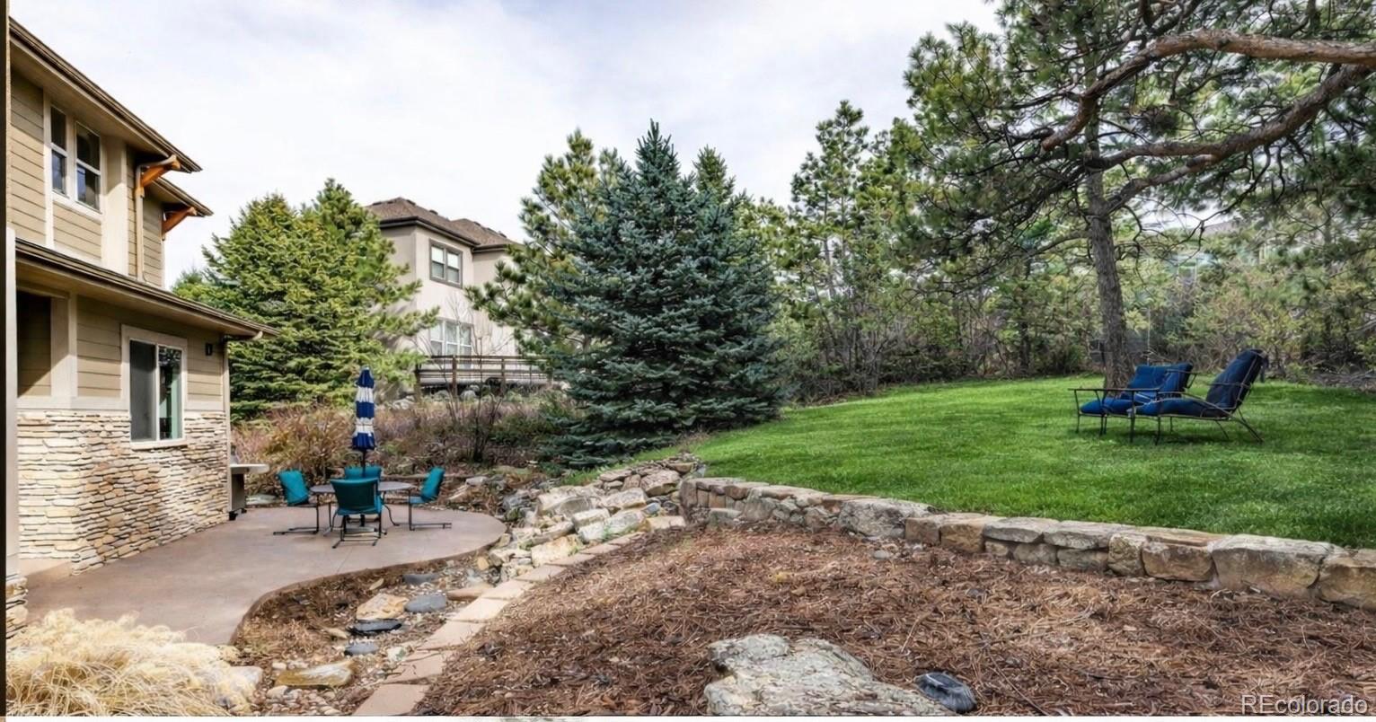 20166 East Shady Ridge Road Parker, CO 80134 - Photo 39 of 50 a view of a backyard with sitting area