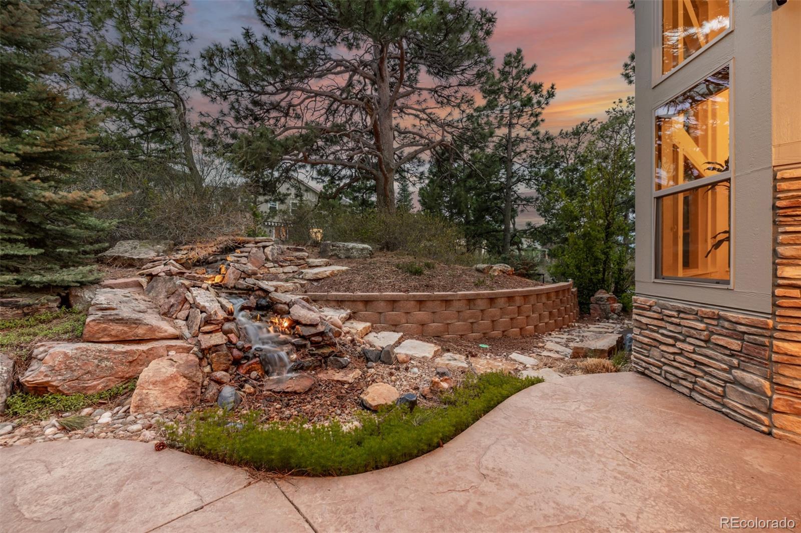 20166 East Shady Ridge Road Parker, CO 80134 - Photo 42 of 50 a view of a backyard with large trees