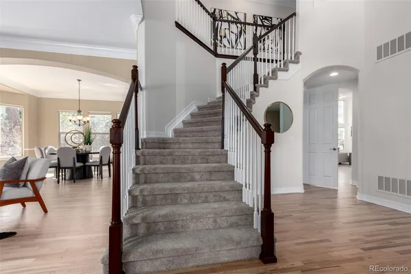 a view of entryway and hall with wooden floor