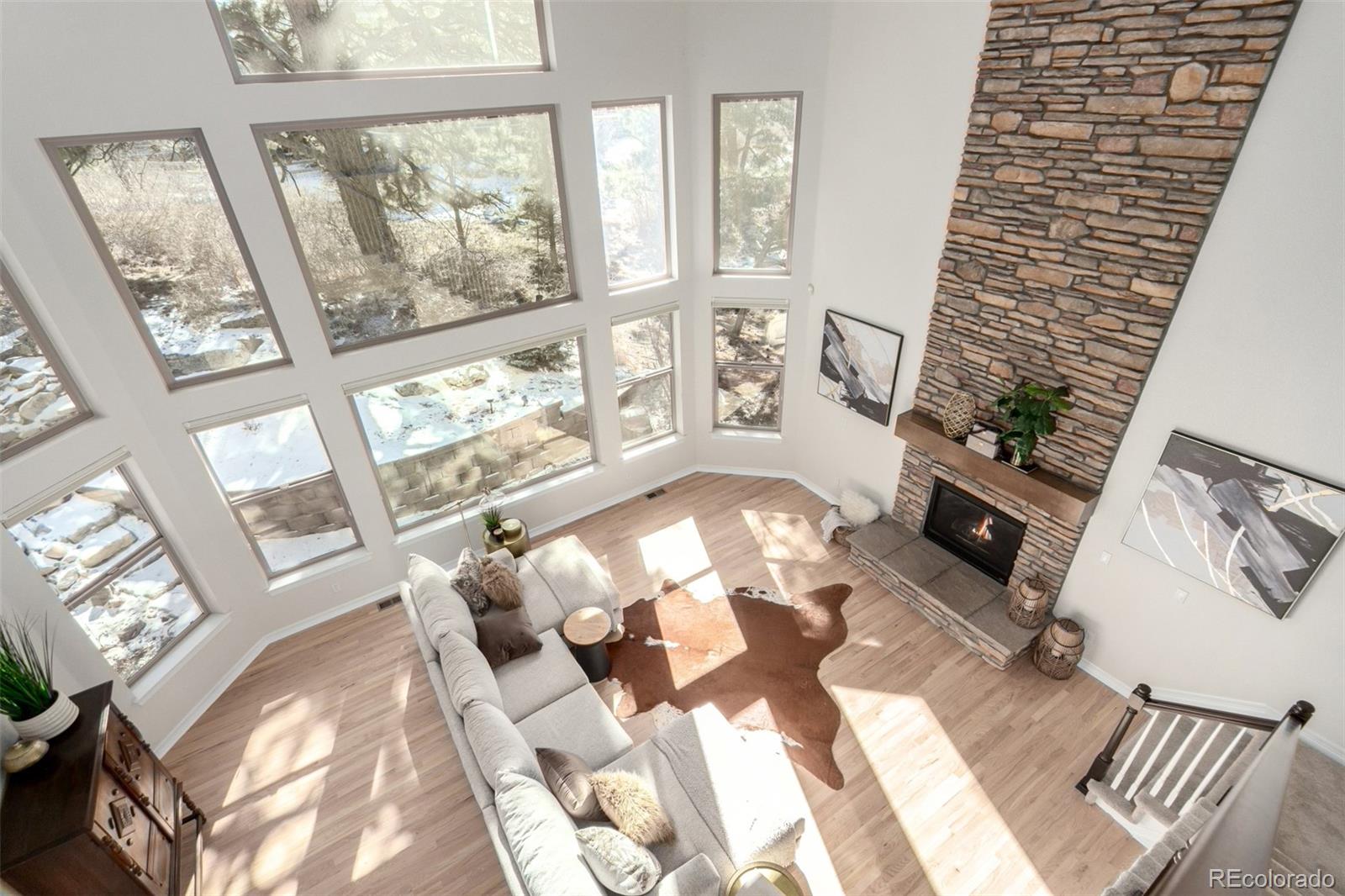 20166 East Shady Ridge Road Parker, CO 80134 - Photo 10 of 50 a living room with furniture and a large window
