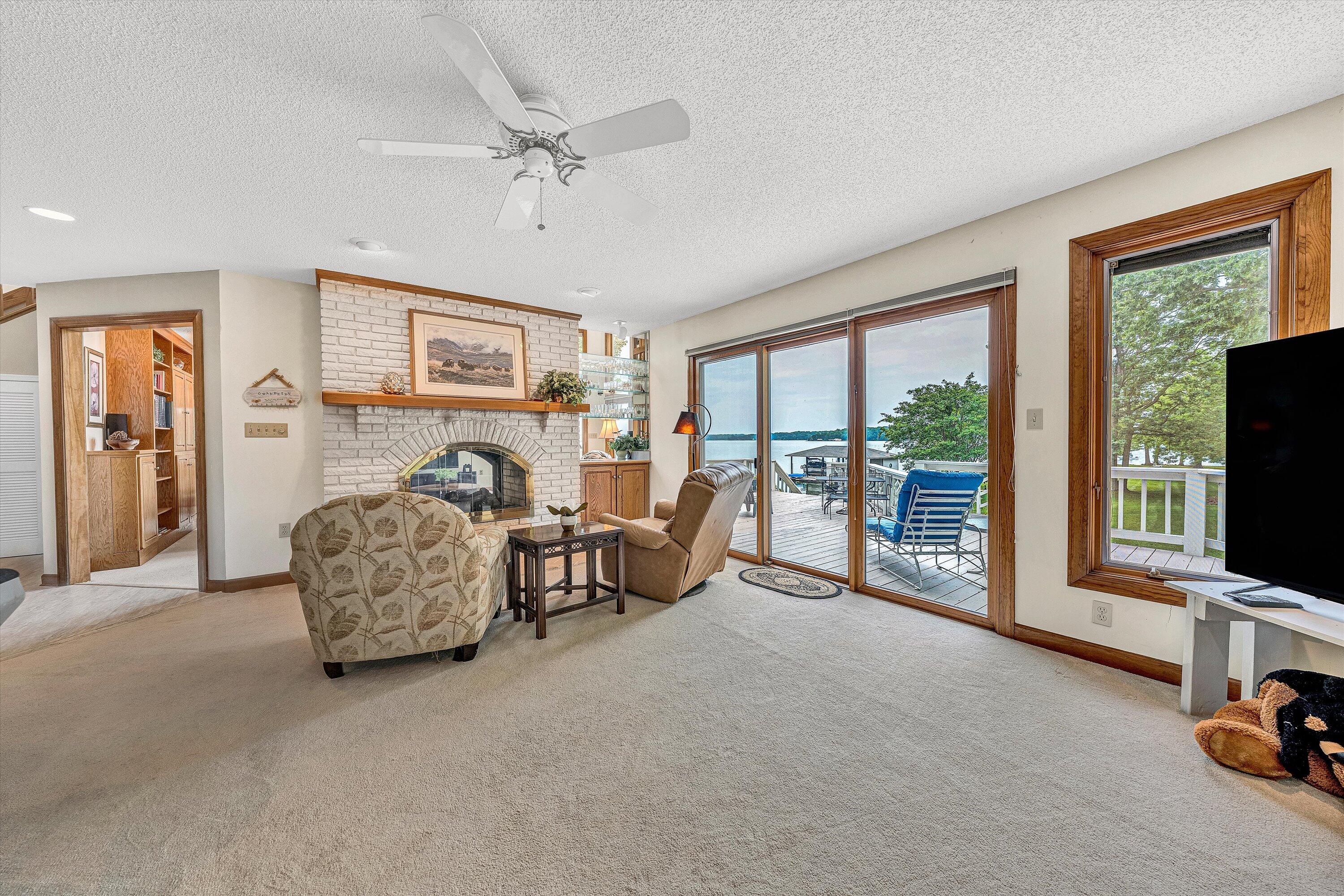 217 Anthony Home Road Huddleston, VA 24104 - Photo 12 of 68 a living room with furniture and a flat screen tv