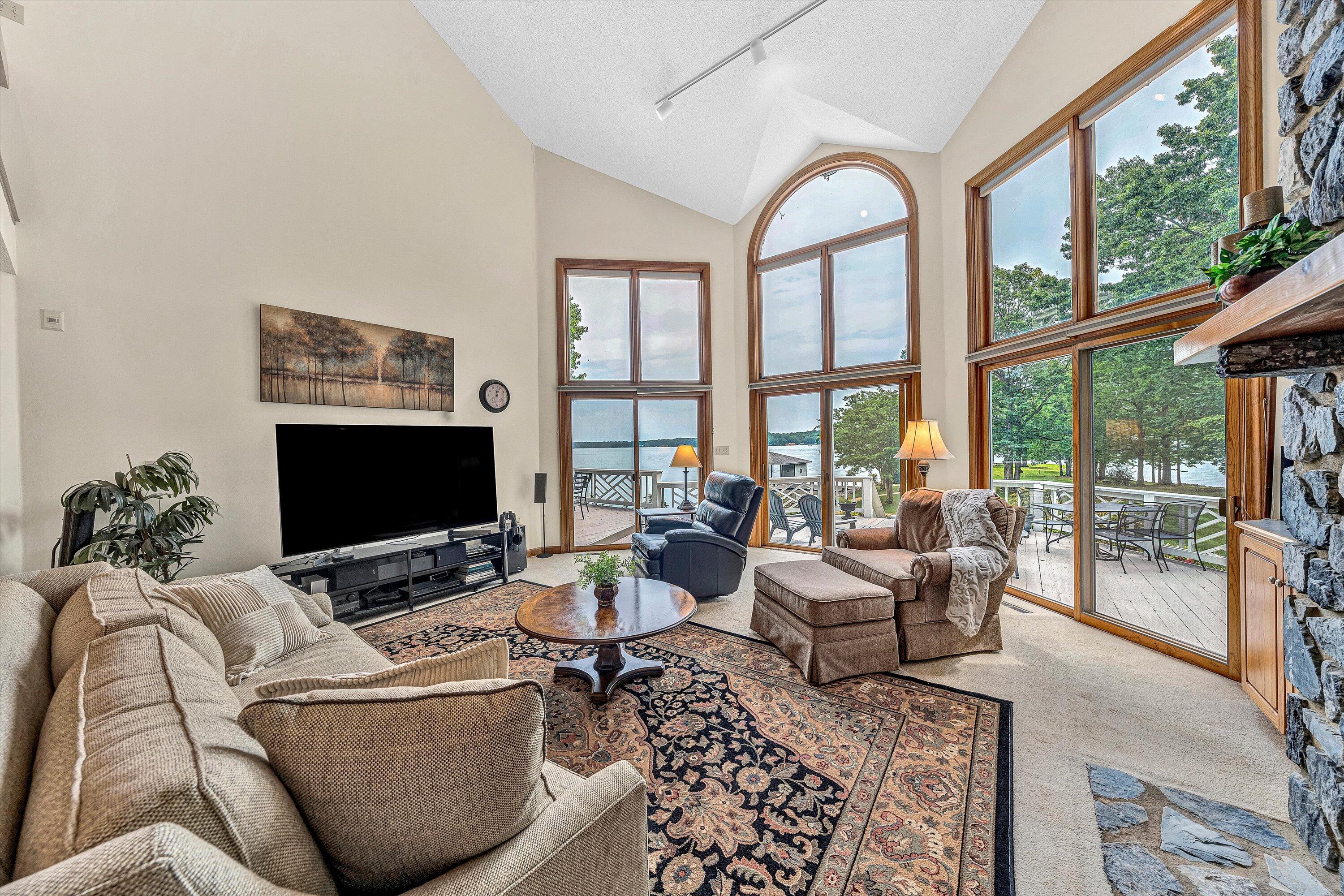 217 Anthony Home Road Huddleston, VA 24104 - Photo 13 of 68 a living room with furniture a flat screen tv and a large window