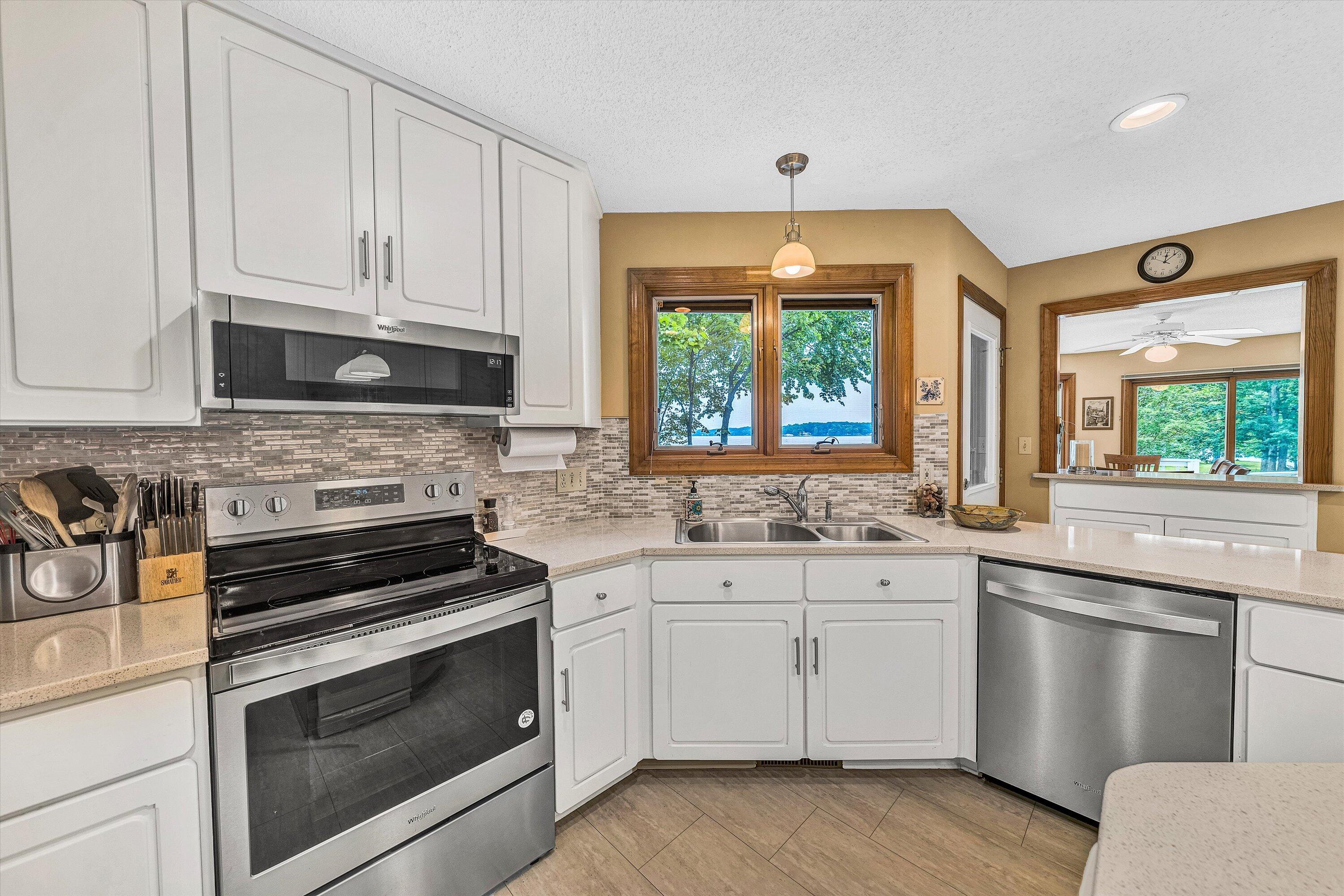 217 Anthony Home Road Huddleston, VA 24104 - Photo 19 of 68 a kitchen with granite countertop white cabinets and a stove