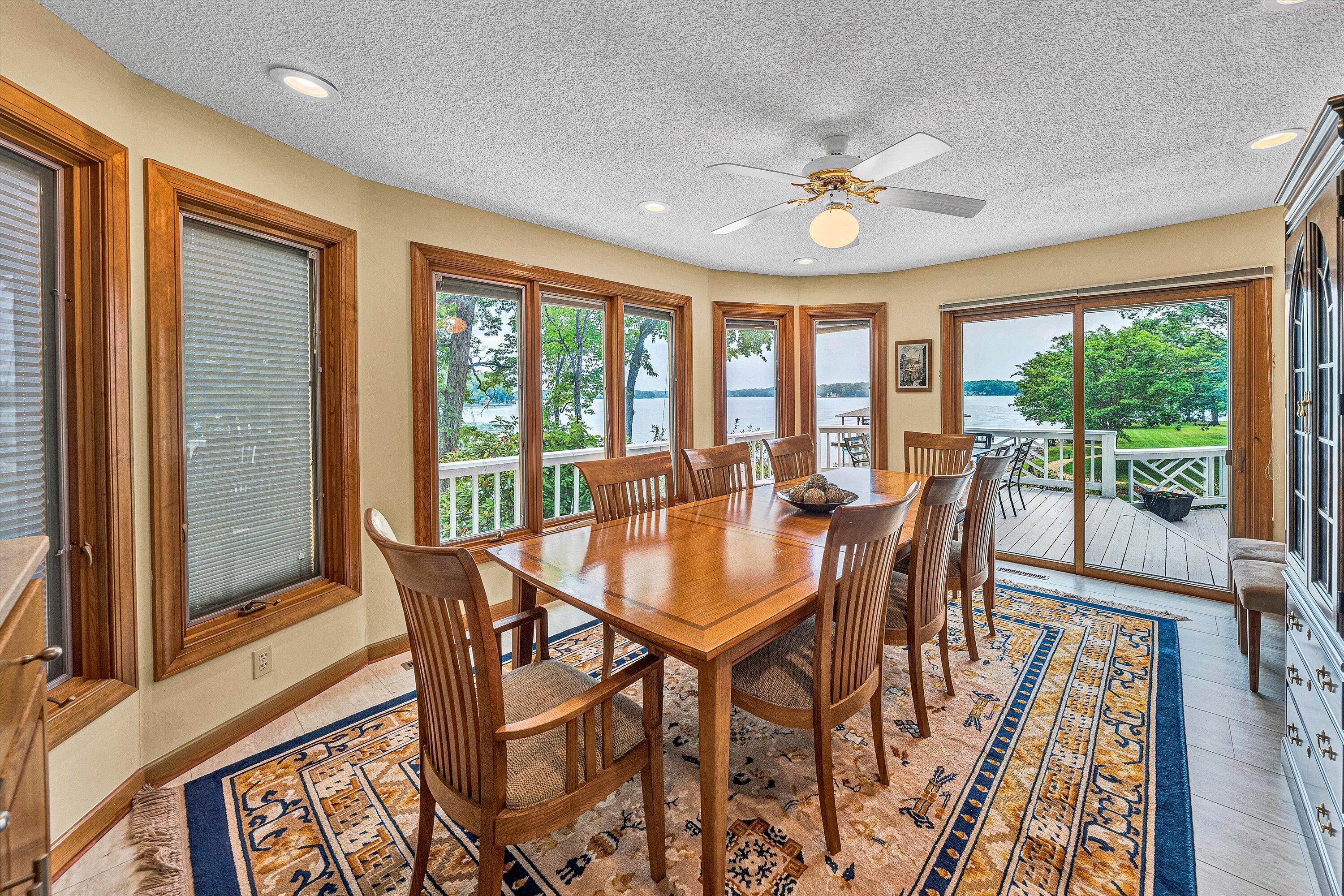 217 Anthony Home Road Huddleston, VA 24104 - Photo 21 of 68 a view of a dining room with furniture large windows and wooden floor