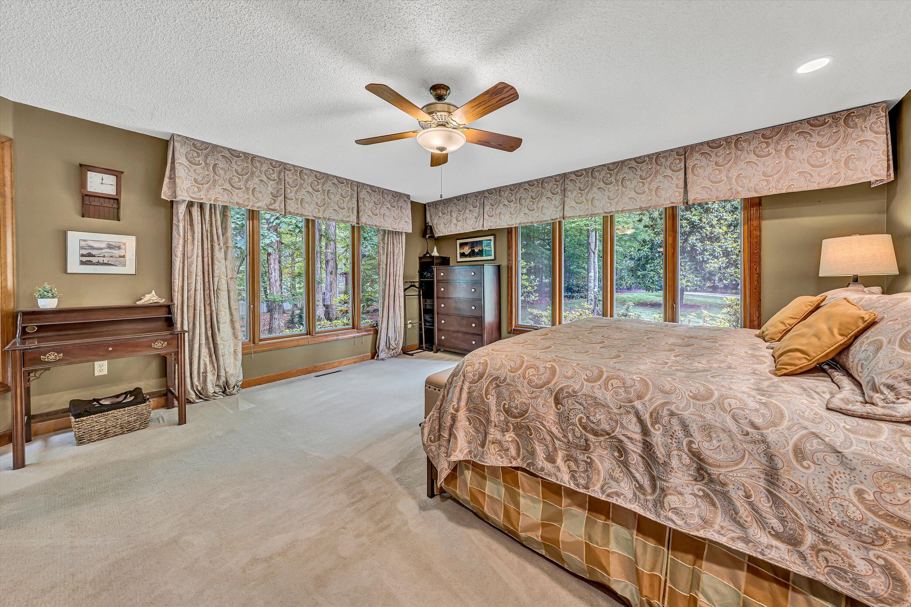 217 Anthony Home Road Huddleston, VA 24104 - Photo 25 of 68 a spacious bedroom with a bed and a large mirror