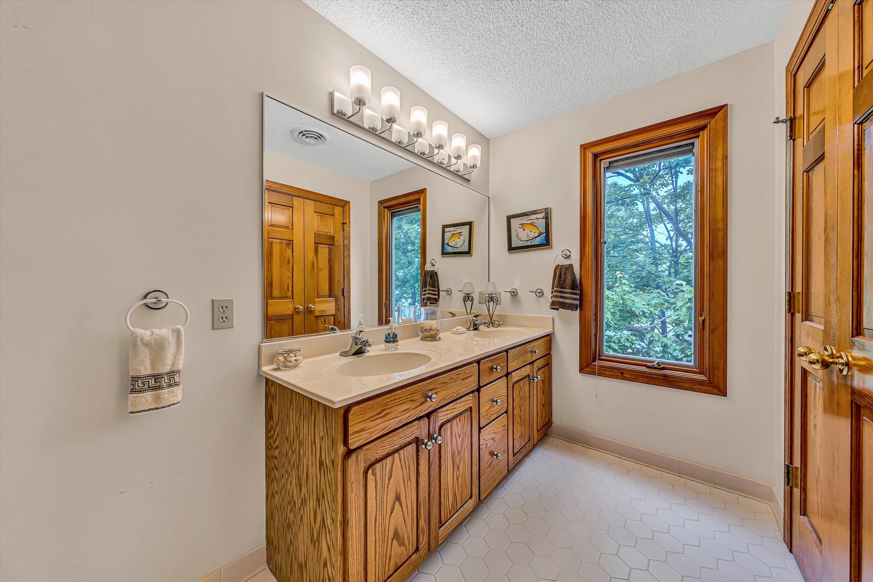 217 Anthony Home Road Huddleston, VA 24104 - Photo 34 of 68 a bathroom with a sink a vanity and a mirror