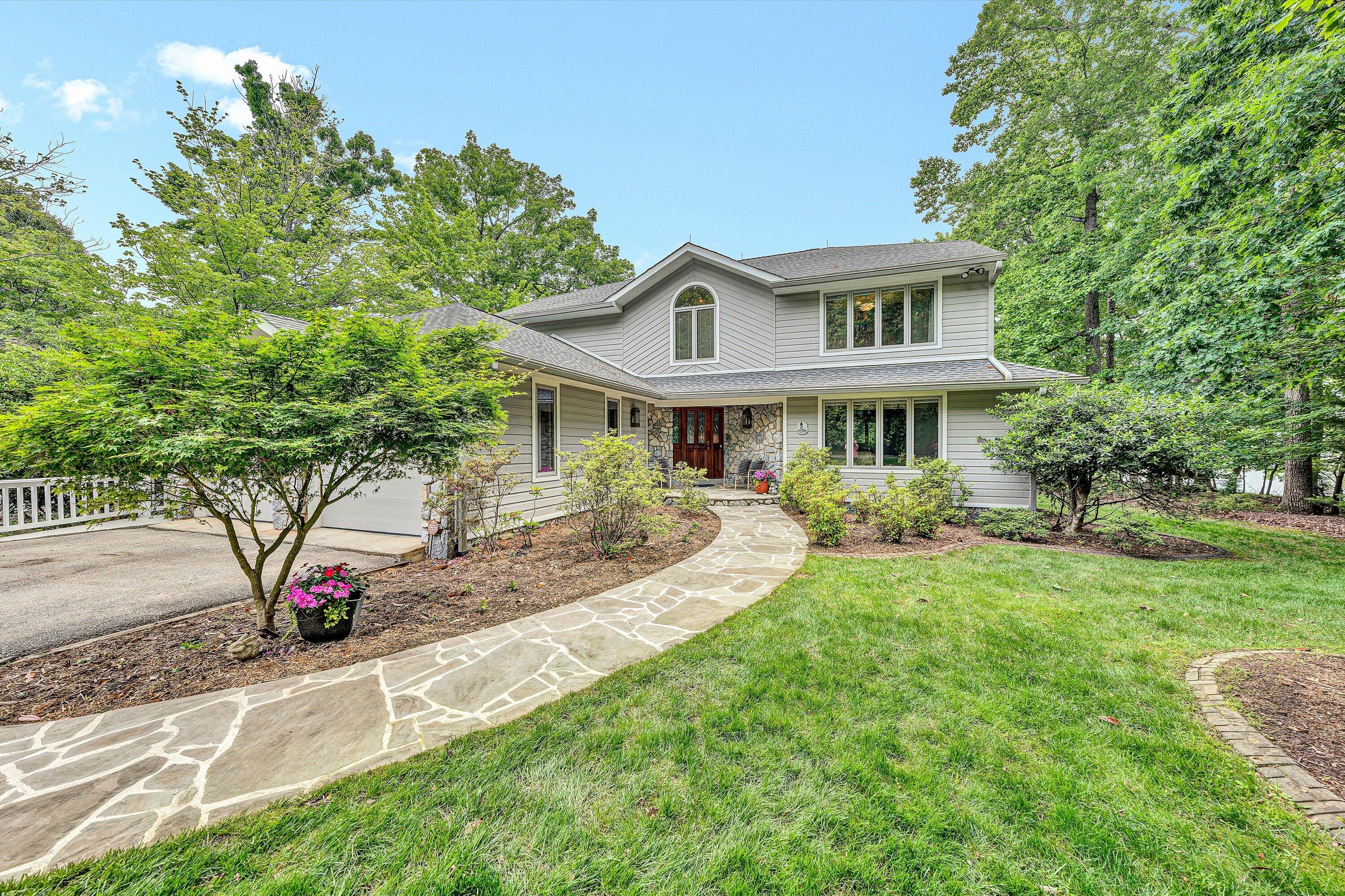 217 Anthony Home Road Huddleston, VA 24104 - Photo 4 of 68 a front view of a house with a yard