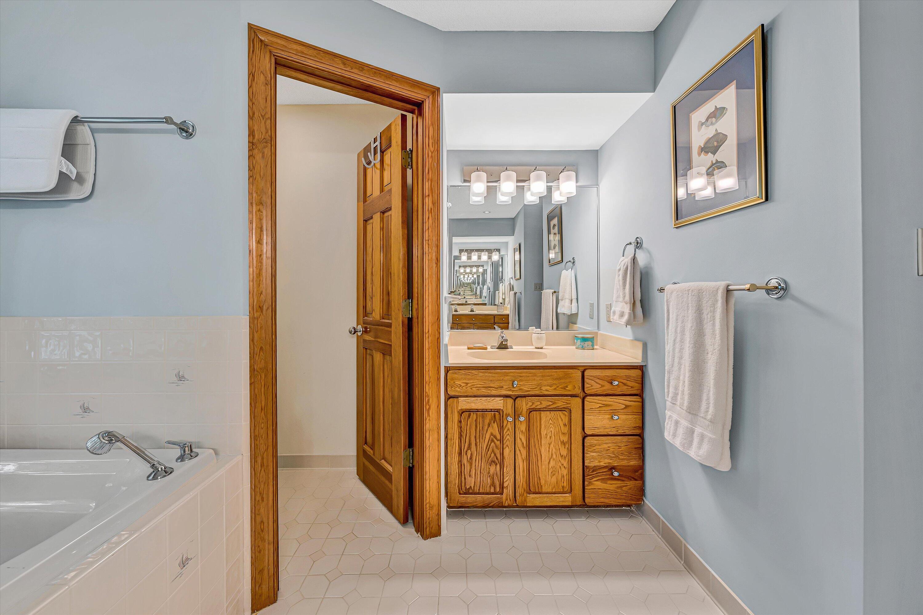 217 Anthony Home Road Huddleston, VA 24104 - Photo 41 of 68 a bathroom with a tub sink and mirror