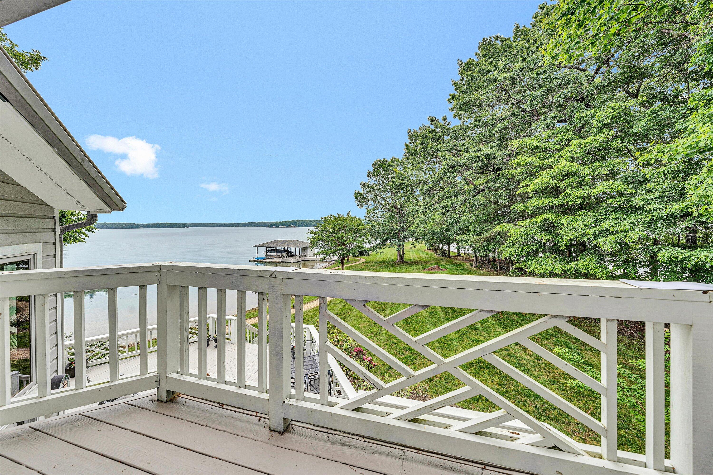 217 Anthony Home Road Huddleston, VA 24104 - Photo 45 of 68 a view of a balcony with floor to ceiling windows with wooden floor