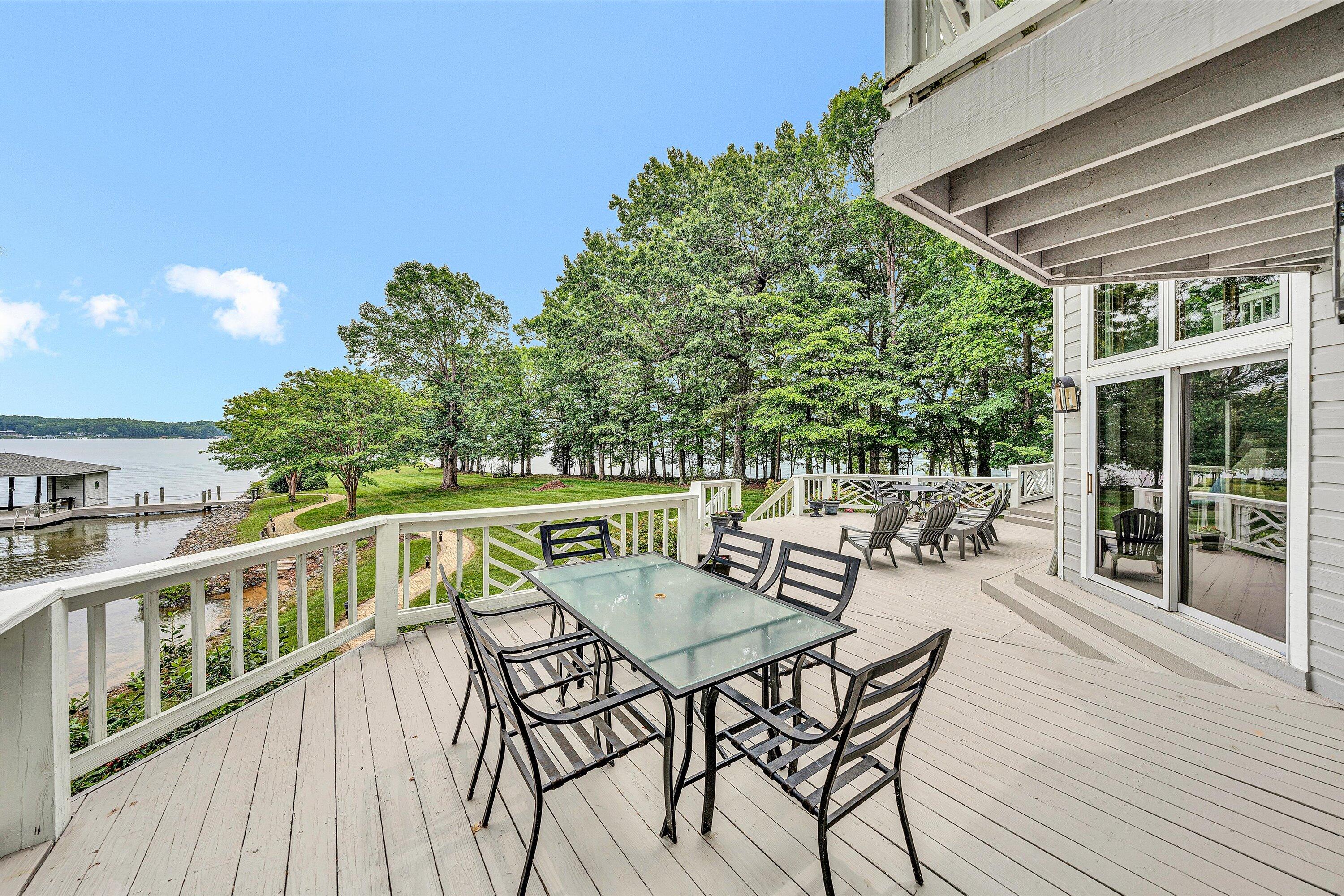 217 Anthony Home Road Huddleston, VA 24104 - Photo 49 of 68 a view of a chairs and table on the wooden deck