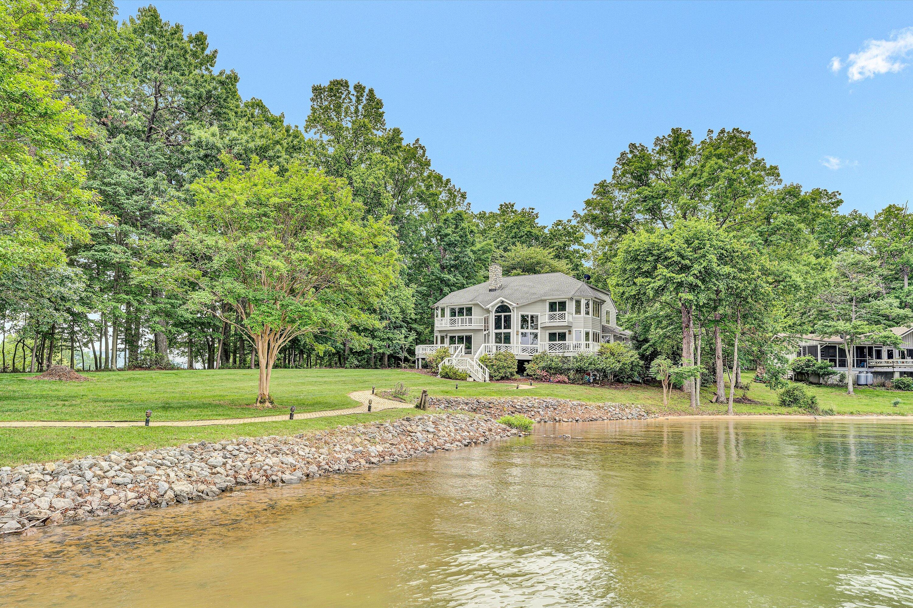 217 Anthony Home Road Huddleston, VA 24104 - Photo 56 of 68 a view of a house with a big yard and palm trees