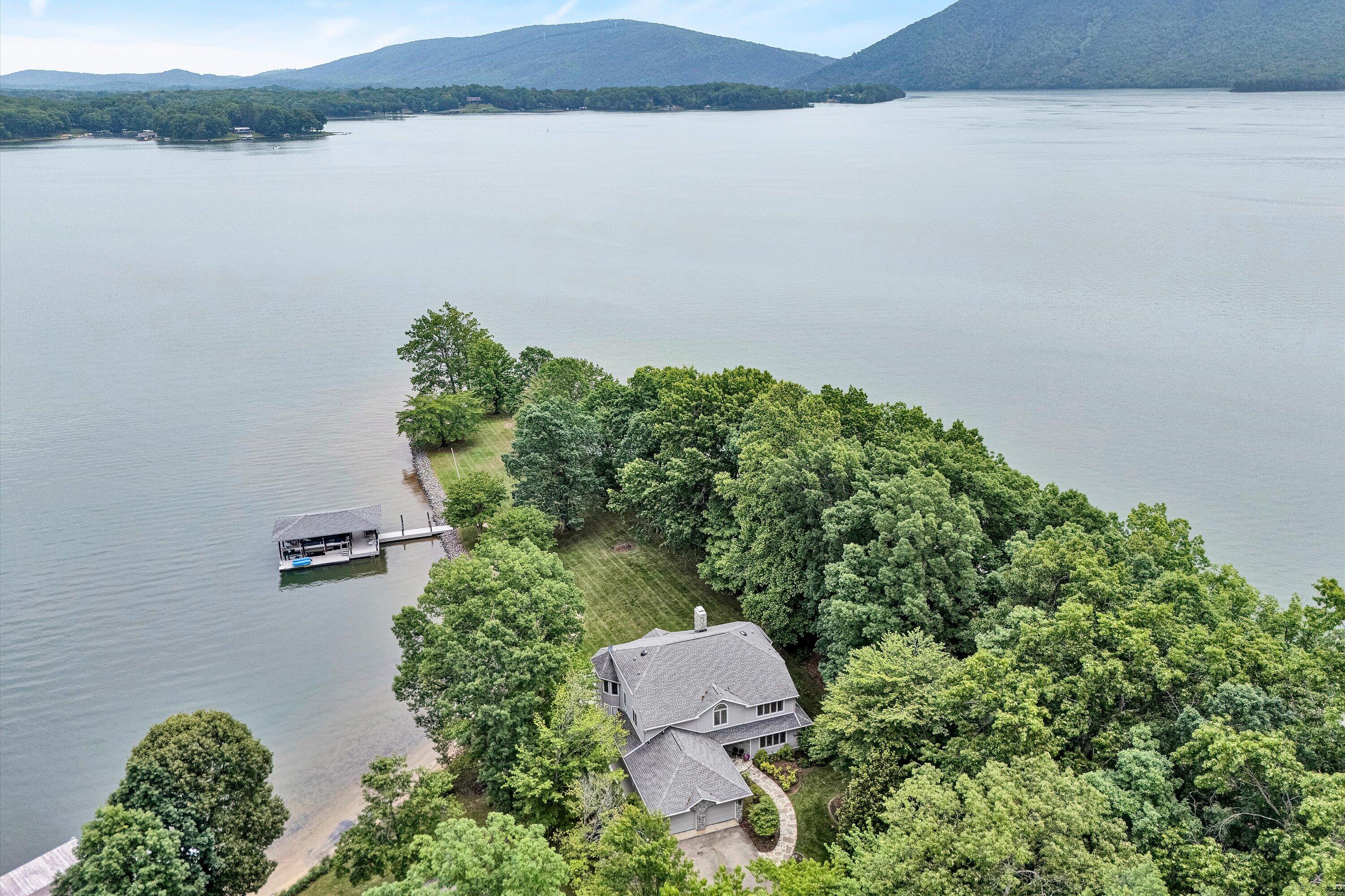 217 Anthony Home Road Huddleston, VA 24104 - Photo 7 of 68 an aerial view of a house with a yard and lake view