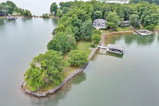 a living room with furniture tv and large windows