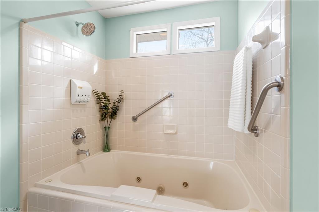 9 Pilot Circle Greensboro, NC 27407 - Photo 25 of 50 Enjoy the outside in in this Lovely Primary bedroom with lots of natural Lighting