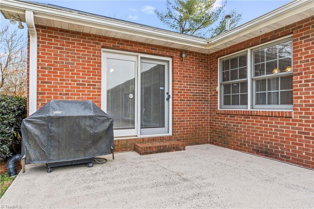 9 Pilot Circle Greensboro, NC 27407 - Photo 40 of 50 What a great sunny room! Screens allow breezes!