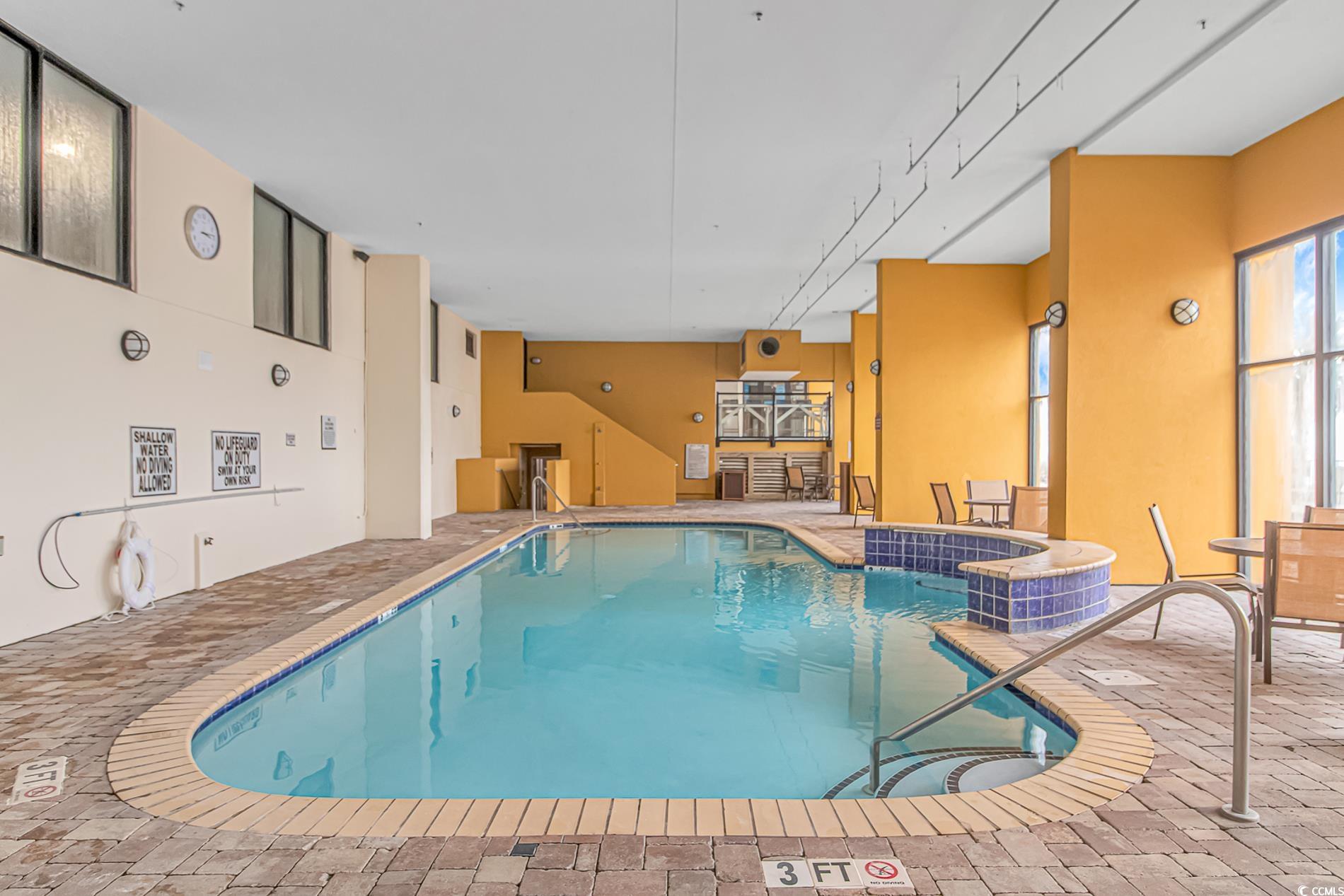 2600 North Ocean Boulevard, Unit 1715 Myrtle Beach, SC 29577 - Photo 23 of 34 Indoor community pool featuring a patio