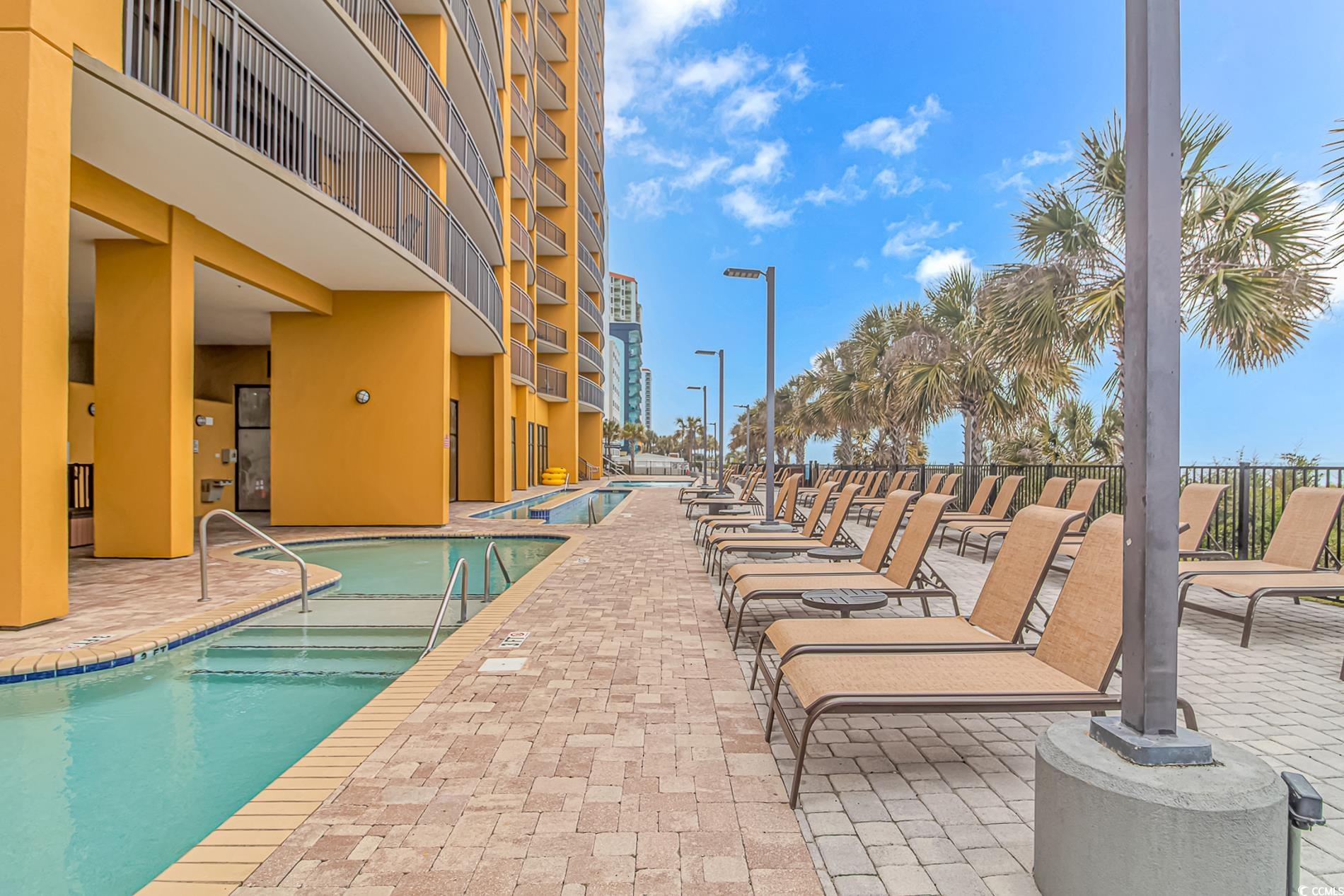 2600 North Ocean Boulevard, Unit 1715 Myrtle Beach, SC 29577 - Photo 24 of 34 Community pool with a patio area