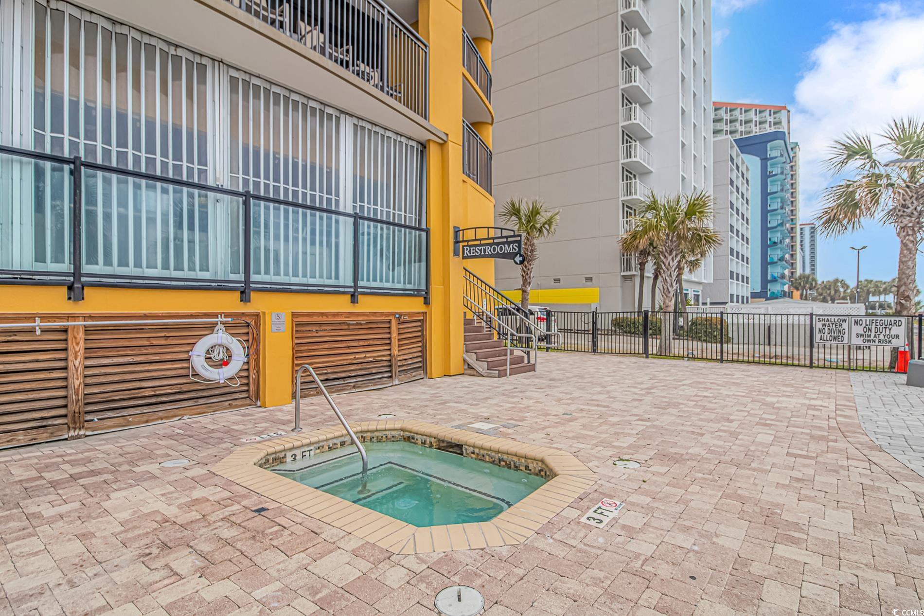 2600 North Ocean Boulevard, Unit 1715 Myrtle Beach, SC 29577 - Photo 25 of 34 View of swimming pool with a community hot tub, stairs, and a patio area