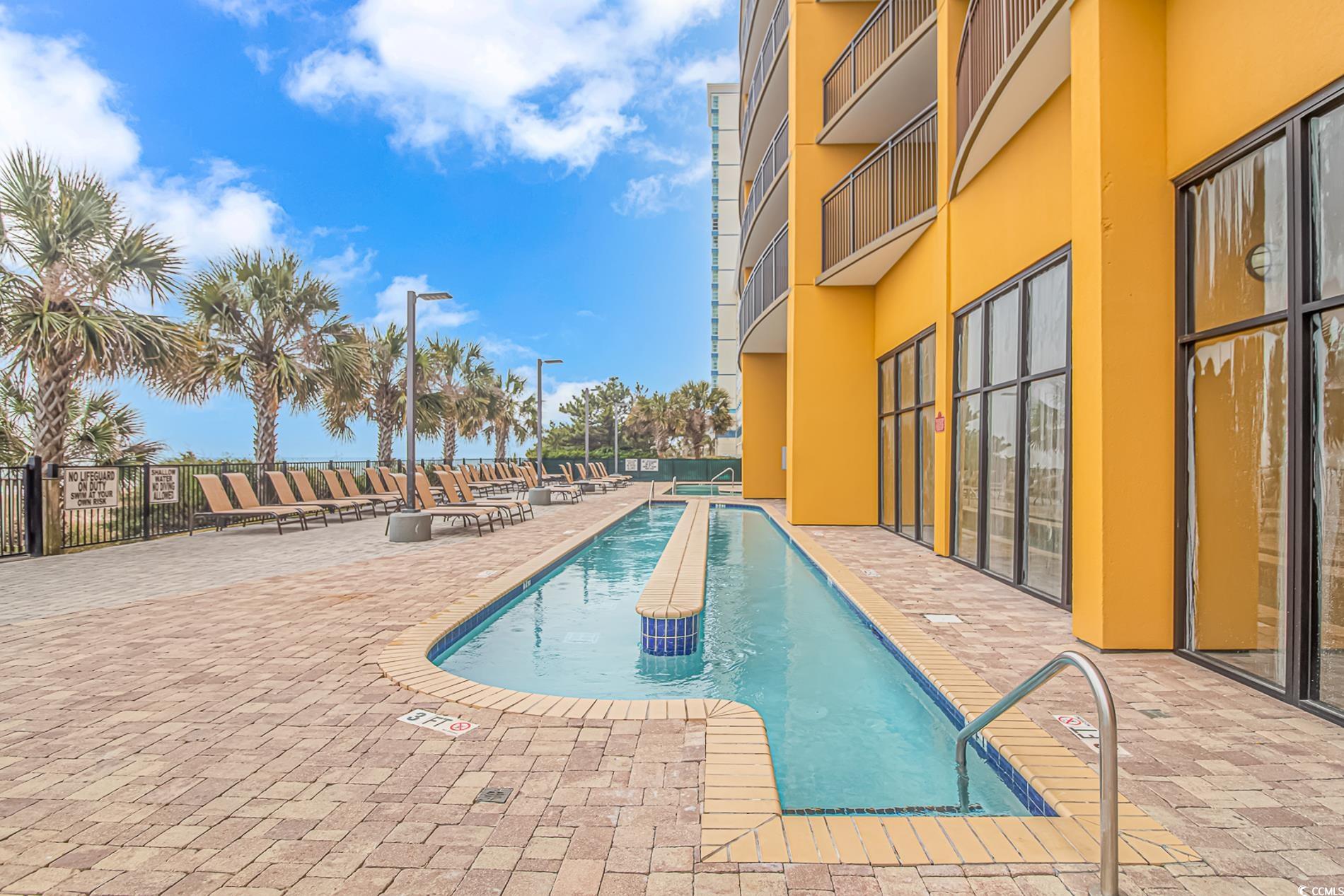 2600 North Ocean Boulevard, Unit 1715 Myrtle Beach, SC 29577 - Photo 26 of 34 Community pool featuring a patio area