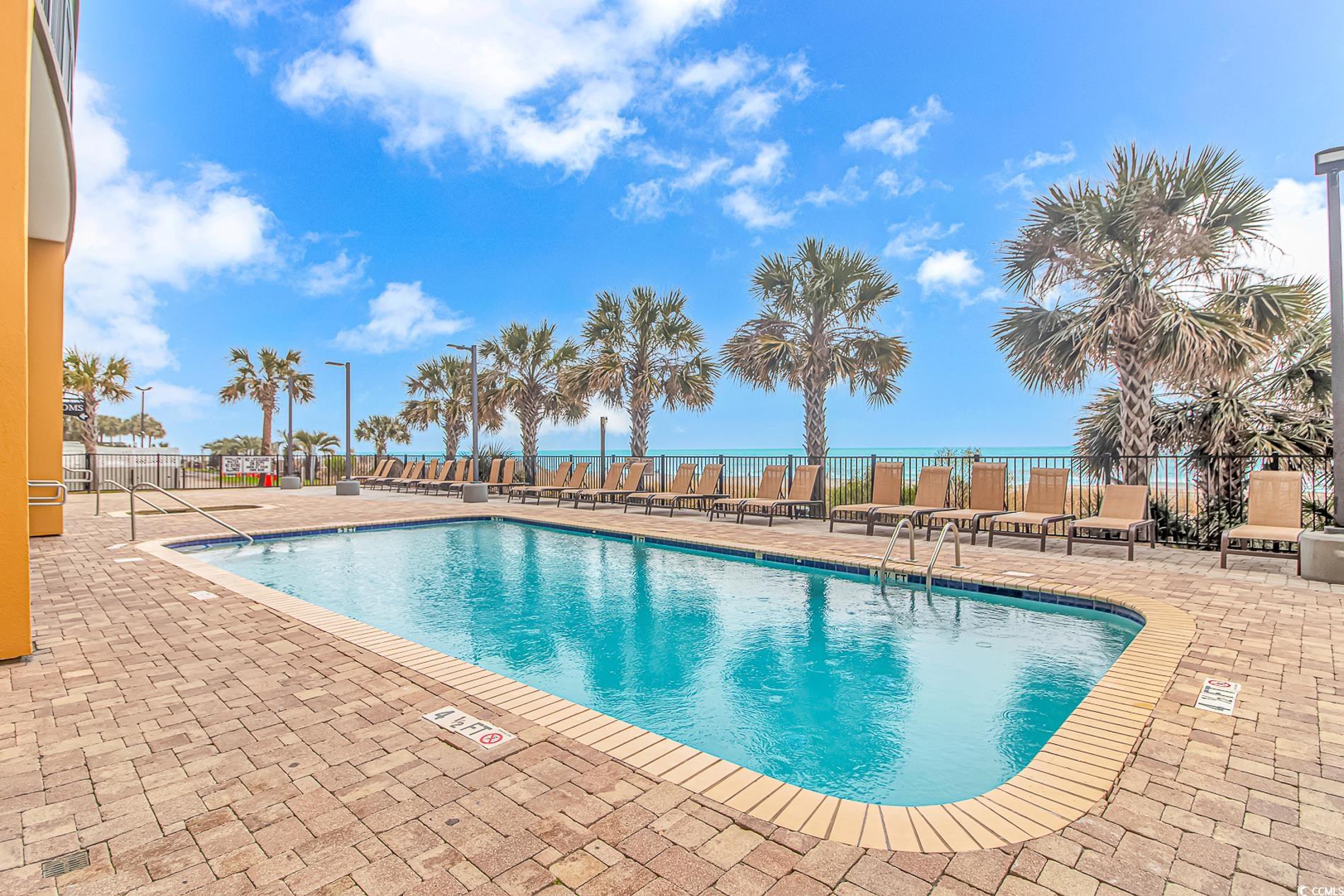 2600 North Ocean Boulevard, Unit 1715 Myrtle Beach, SC 29577 - Photo 27 of 34 Community pool with a patio area