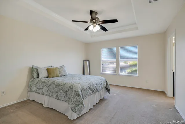 a bedroom with a bed and window