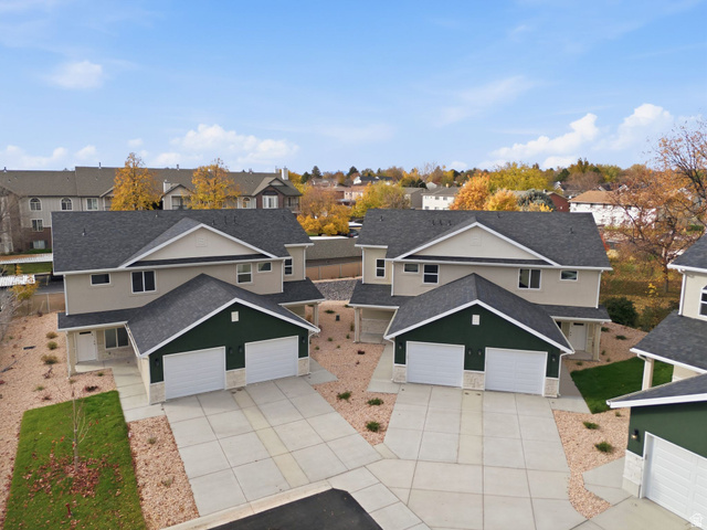 1615 North Angel Street, Unit H Layton, UT 84041 - Photo 43 of 55 Traditional-style home featuring a shingled roof, concrete driveway, and a residential view
