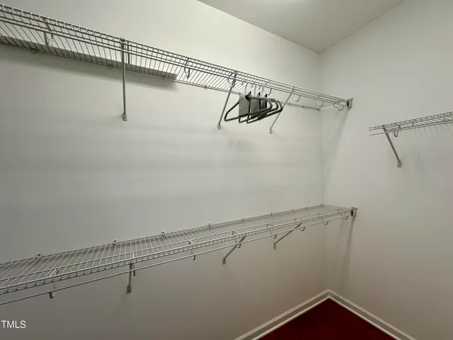 a view of a room with racks on the wall