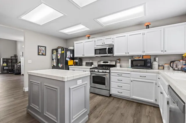 a view of a dining room with furniture and wooden floor