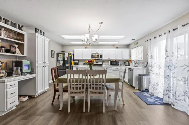 a kitchen with stove a microwave and refrigerator