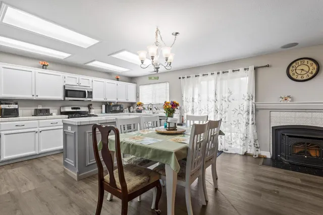 a large bedroom with a bed and a chandelier