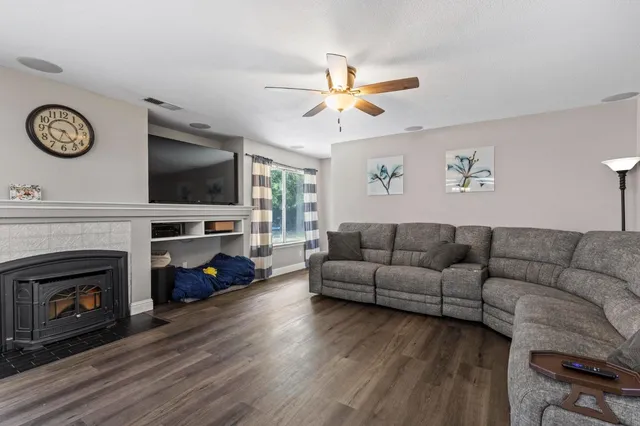 a living room with furniture kitchen view and a dining table